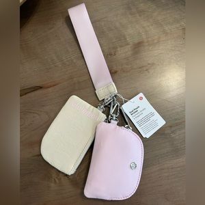 New in package Lululemon Duel Pouch Wristlet - White Opal/Meadowsweet Pink